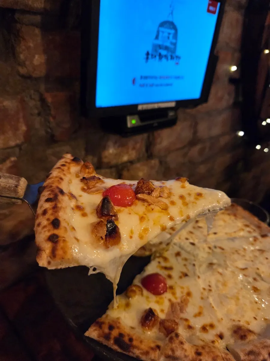 Leftover pizza crusts and the table at the end of the meal