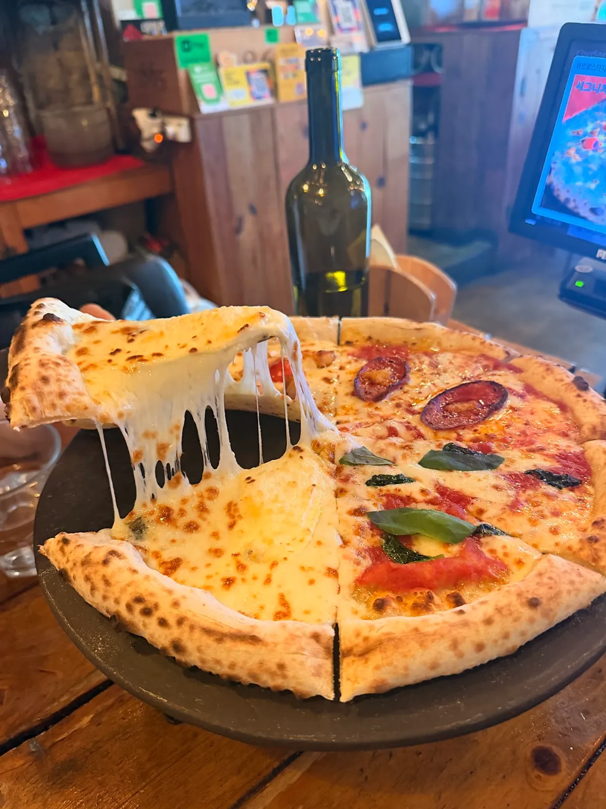 Quattro Stagioni pizza and draft beer at Hongdae Hwadeok Pizza