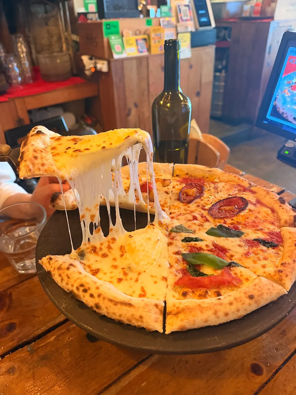 Dipping the wood-fired crust end in honey