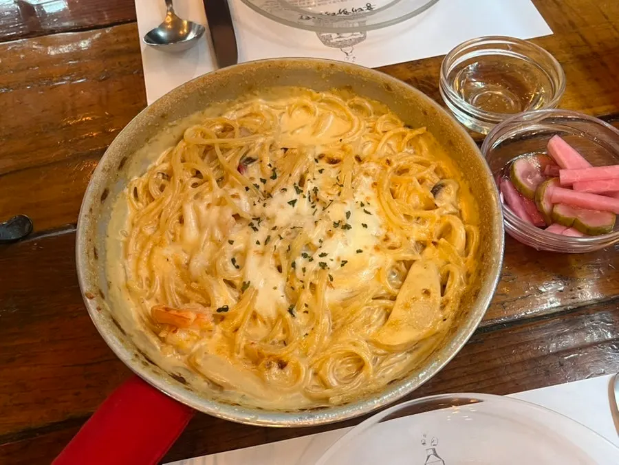 Gamberi crema pasta topped with cheese