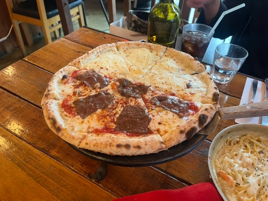 Slice of Quattro Formaggi topped with four kinds of cheese