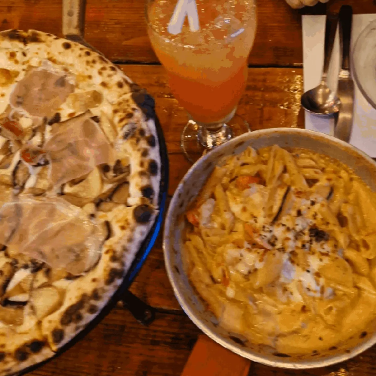 Signature half-and-half wood-fired pizza at Hongdae Hwadeok Pizza
