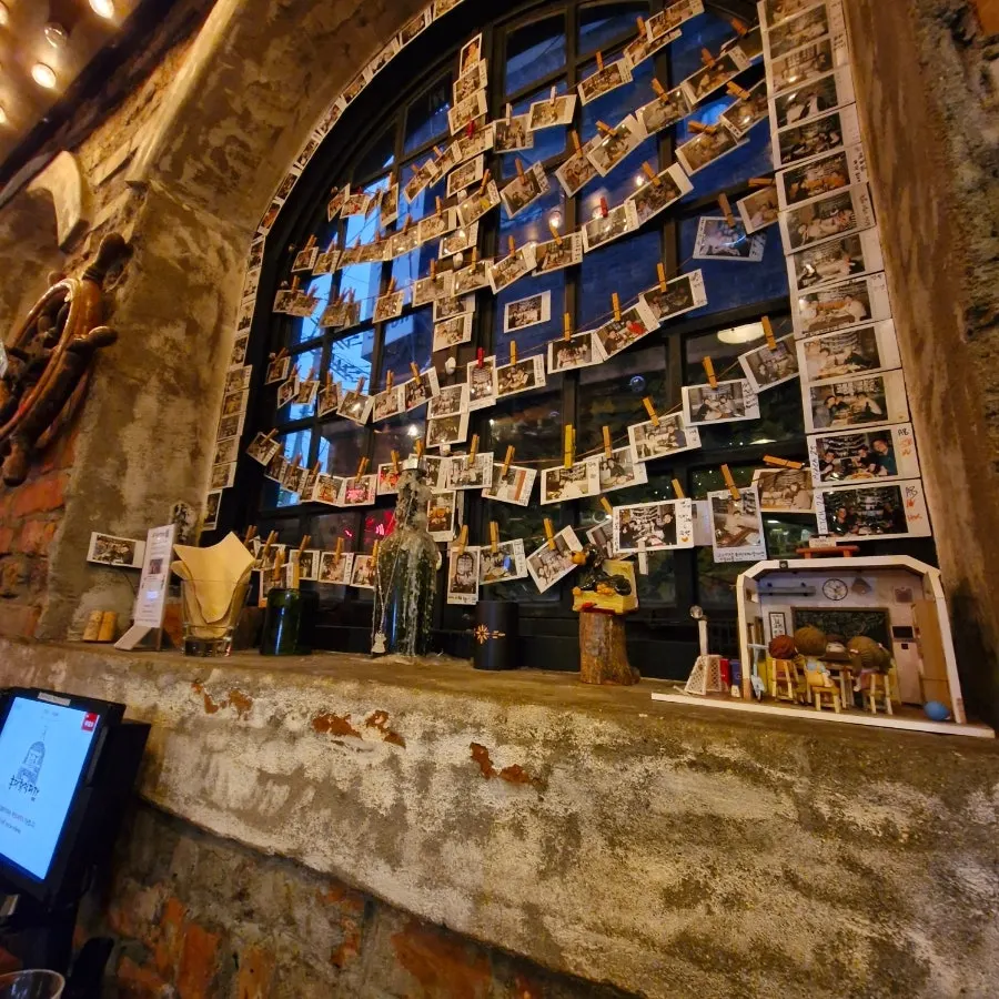 Cozy, softly lit seating inside Hongdae Hwadeok Pizza
