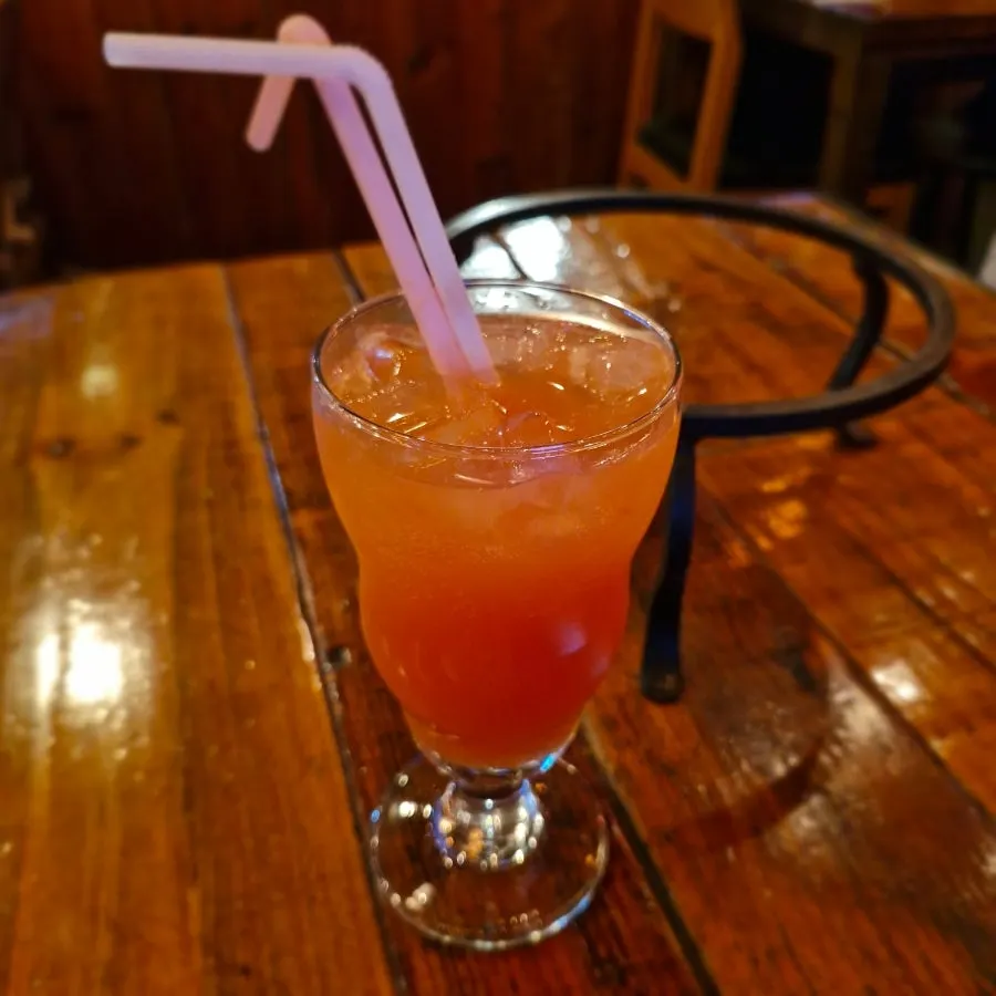 Grapefruit ade and tableware on the table