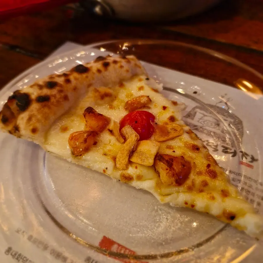 Half-and-half wood-fired pizza with croccante and funghi prosciutto