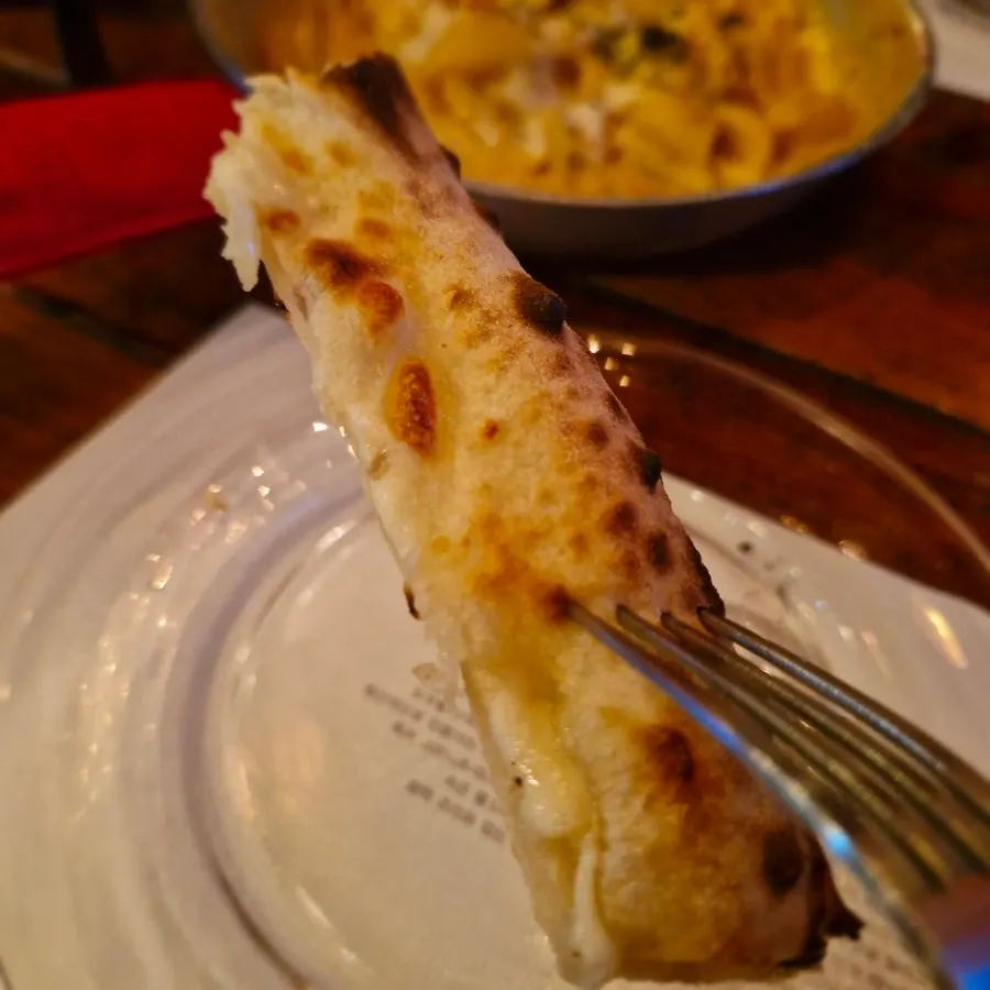 Freshly baked pizza dough crust edge