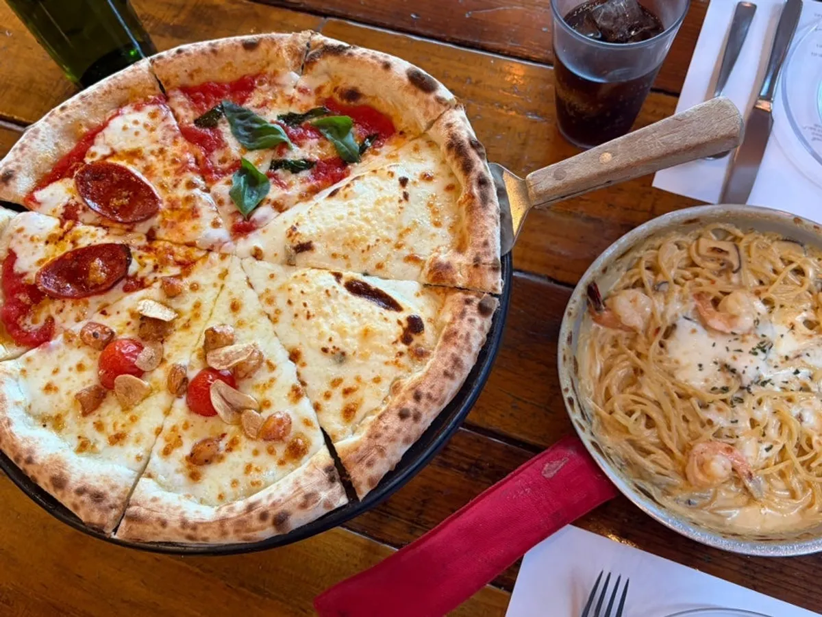A whole Quattro Stagioni pizza fresh from the oven