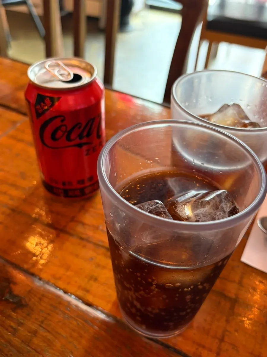 Two cups of ice served alongside the drink
