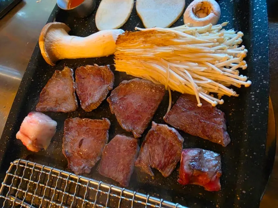 Diced fried rice cooking on the grill