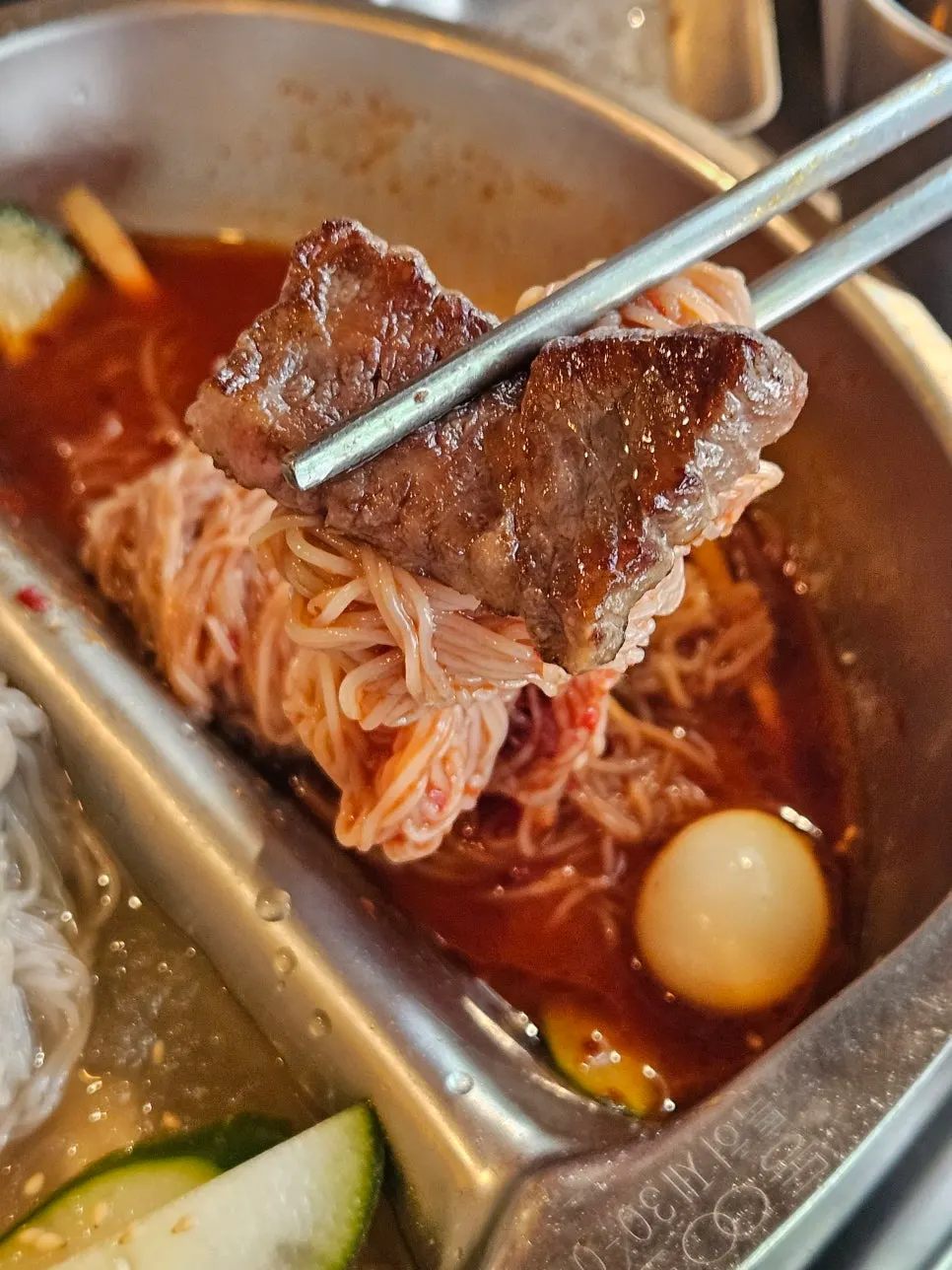 Meat wrapped in bibim-naengmyeon