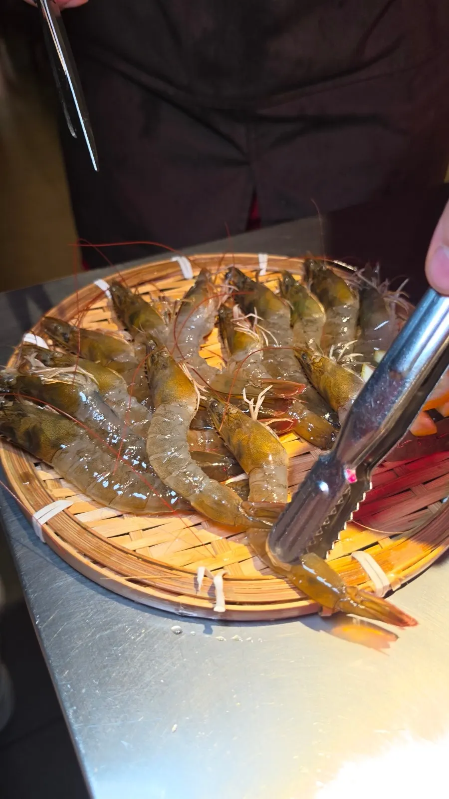 A full table setting of ordered live shrimp sashimi