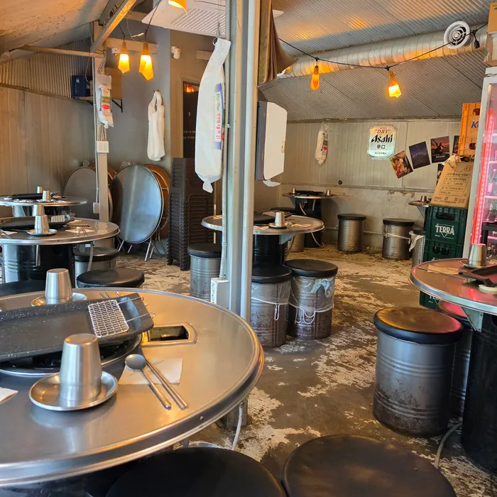 Interior of the restaurant with a charcoal-grill house atmosphere