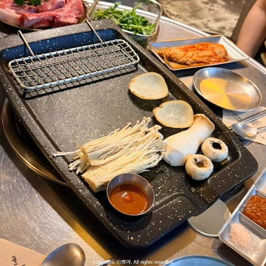 Vegetables grilling alongside the meat