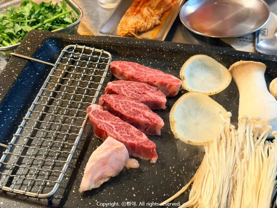 A grilled piece of Korean beef and pork neck
