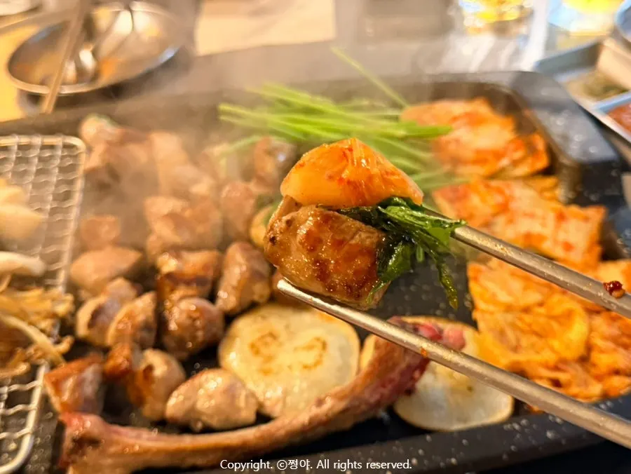Finished grilled meat with side vegetables