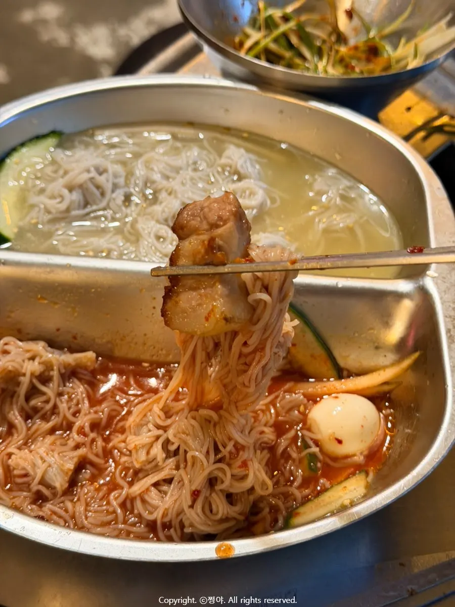 Bibim noodles served alongside the meat