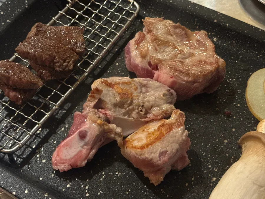 Thick pork neck and short rib grilling on the tabletop
