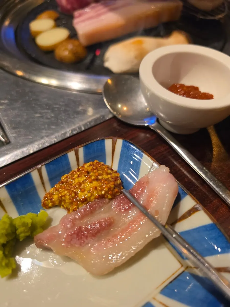 Close-up of glossy grilled pork neck