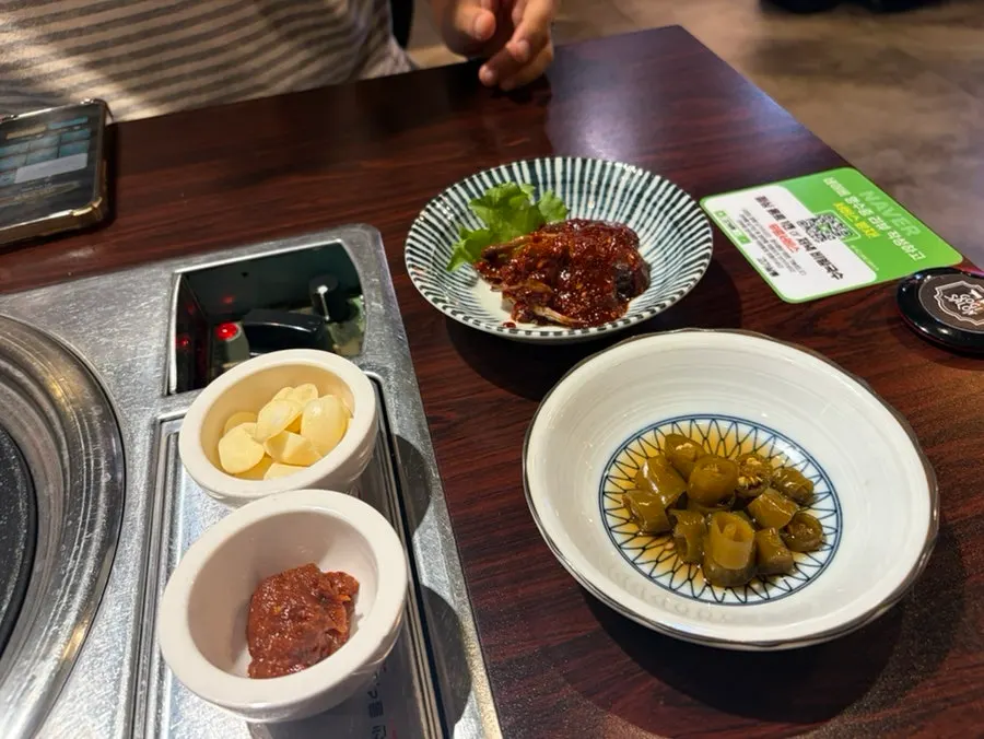 Salt, wasabi, and whole grain mustard set out on the table