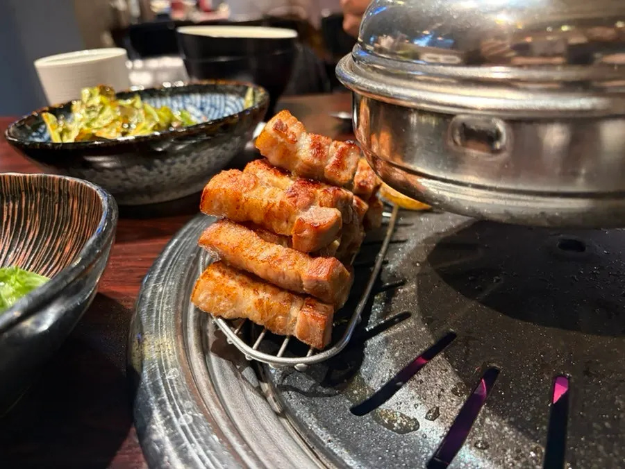 Close-up of golden-brown grilled pork belly