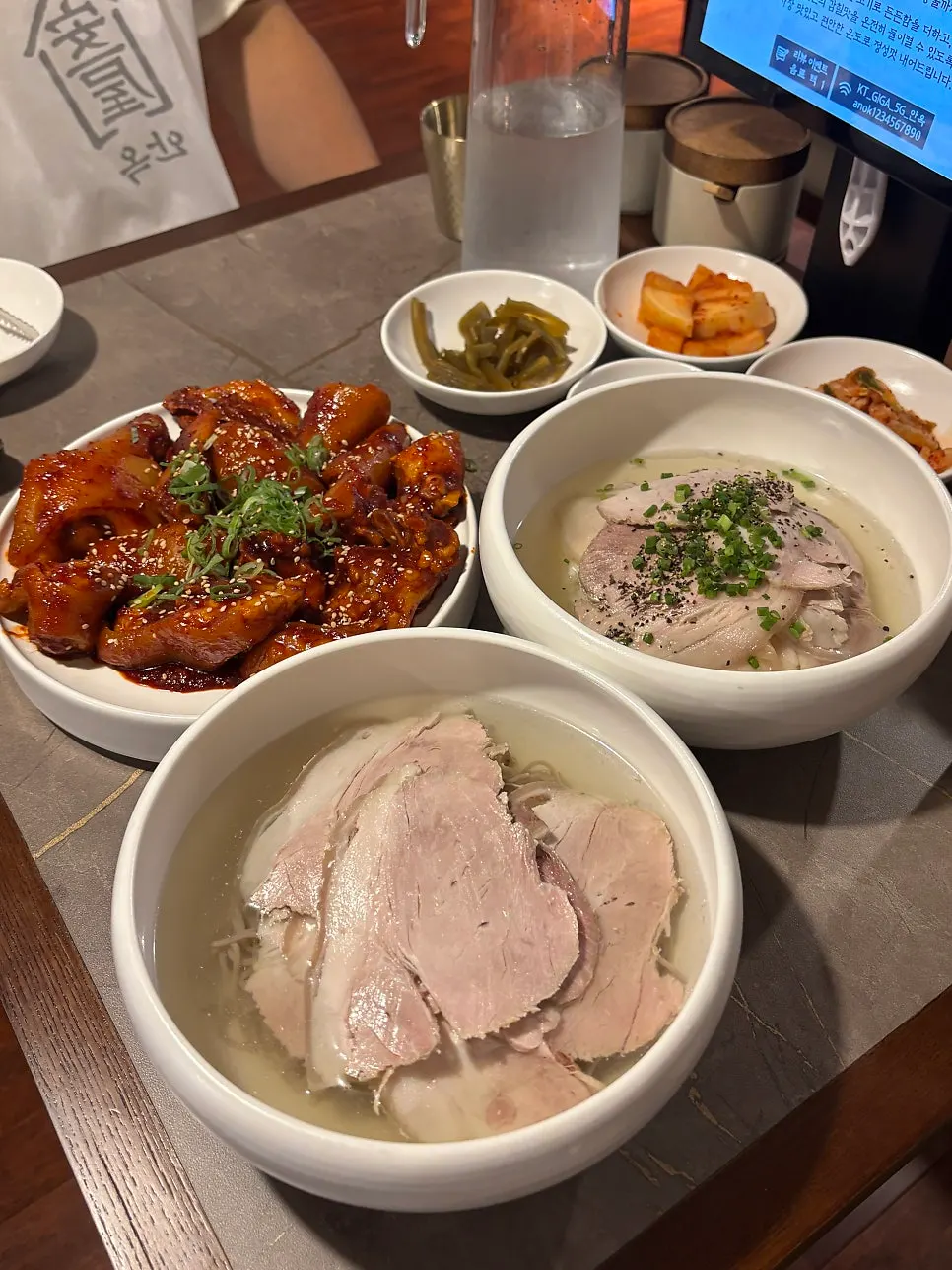 A full spread of gomtang, cold noodles, and braised pork tail