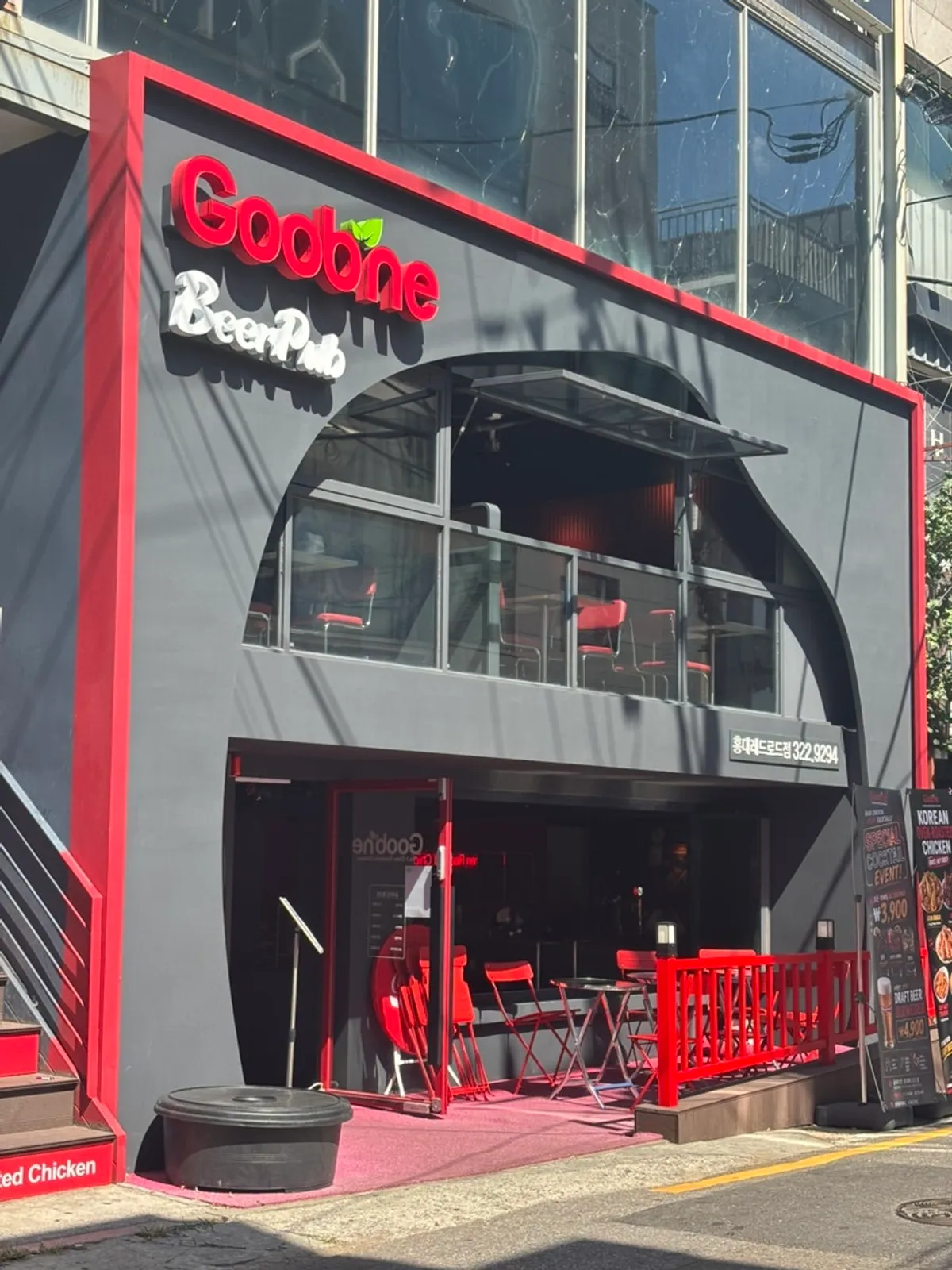 Exterior of Goobne Chicken Hongdae Red Road decorated in red accents