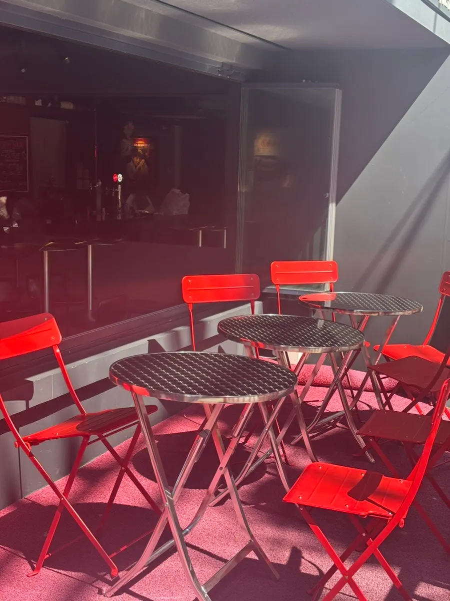 Outdoor terrace seating decorated in red