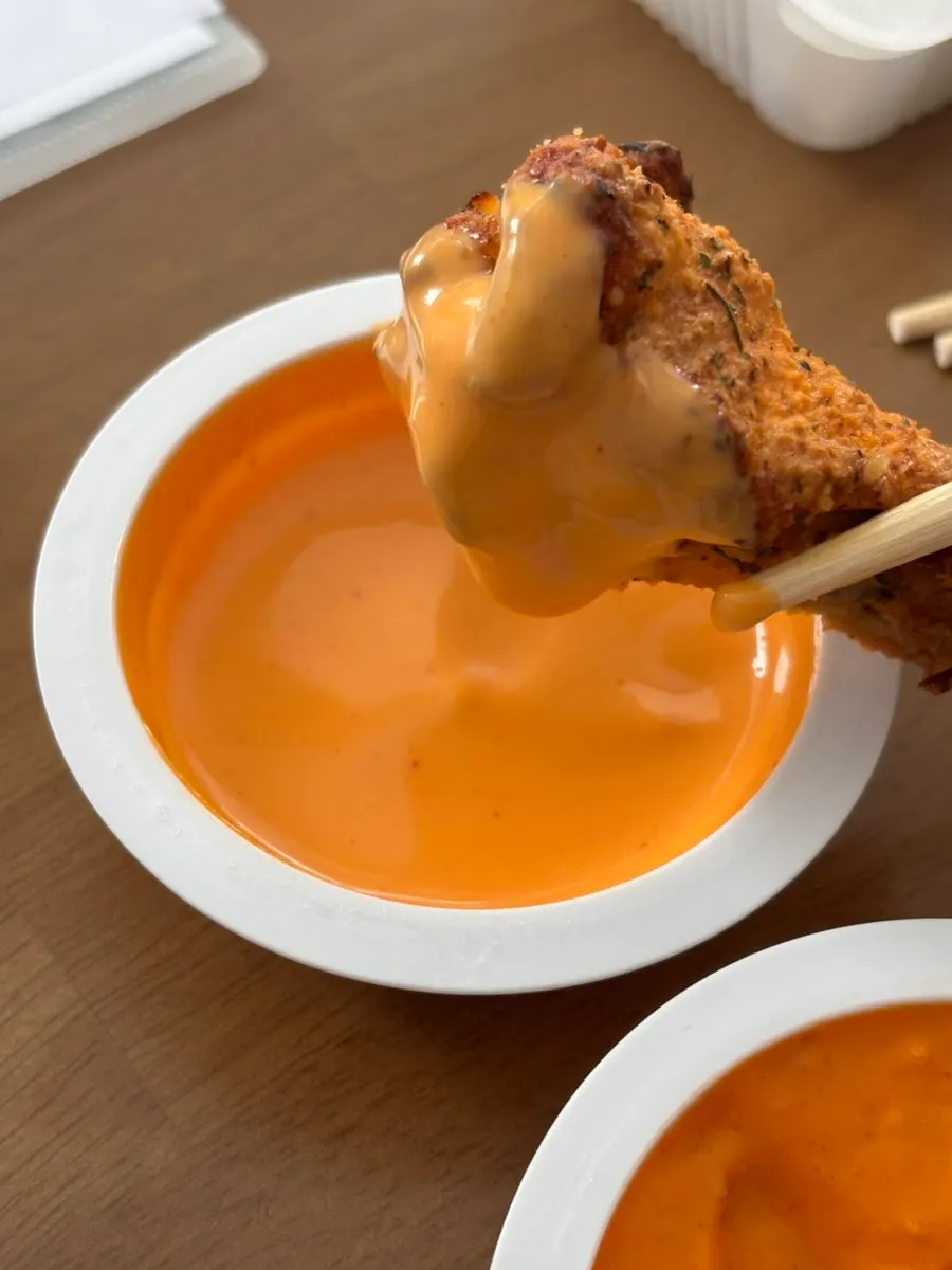 A piece of chicken paired with Marbling sauce