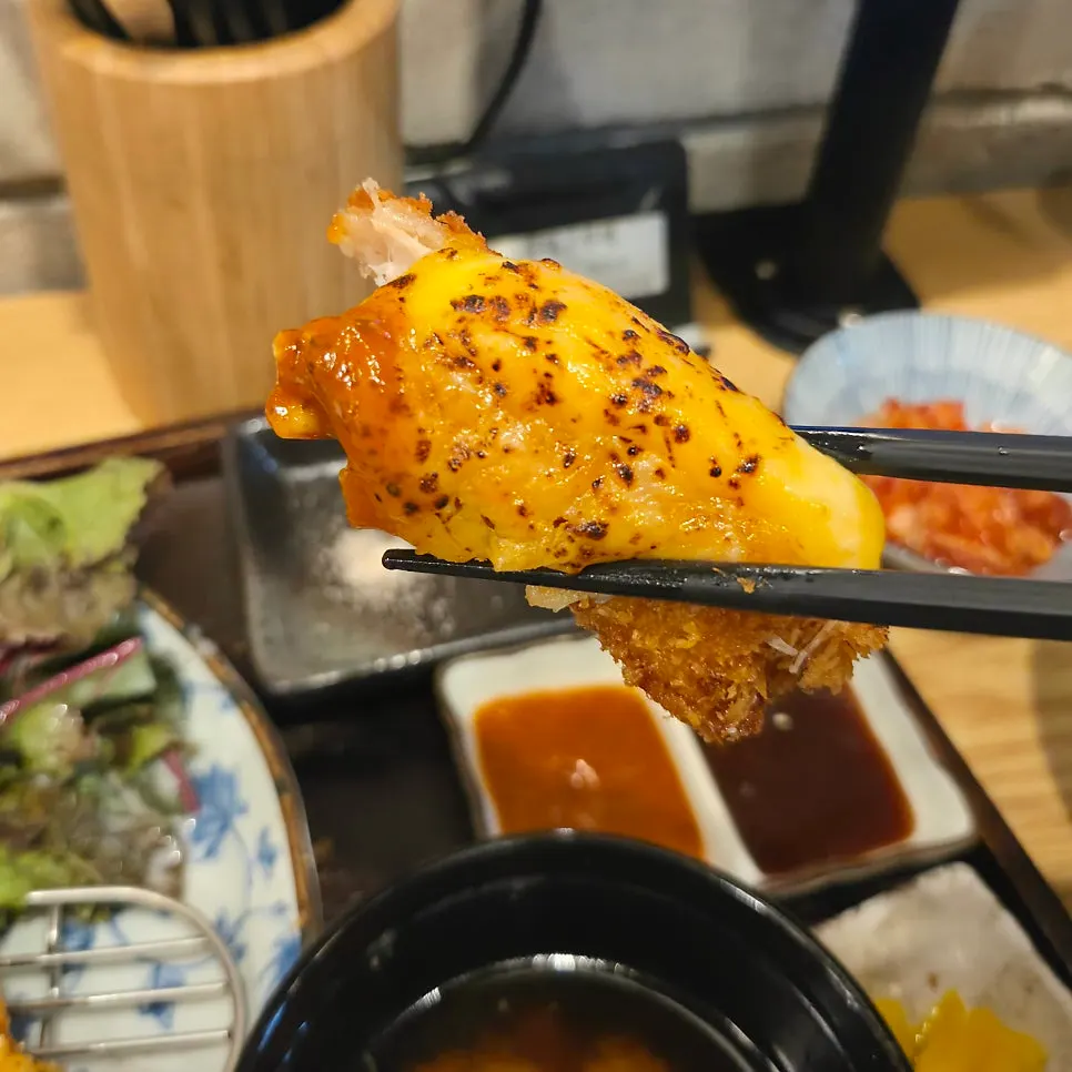Side dishes and rice served with the mixed katsu B set