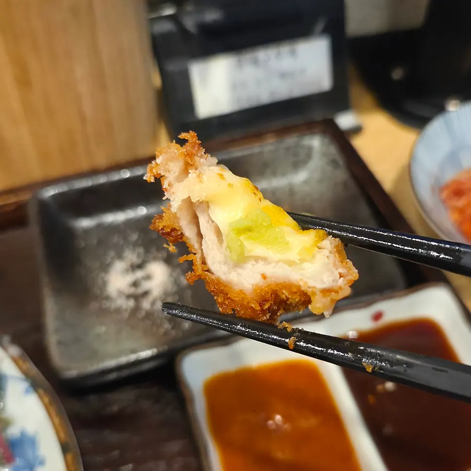Cheese katsu dipped in spicy sauce