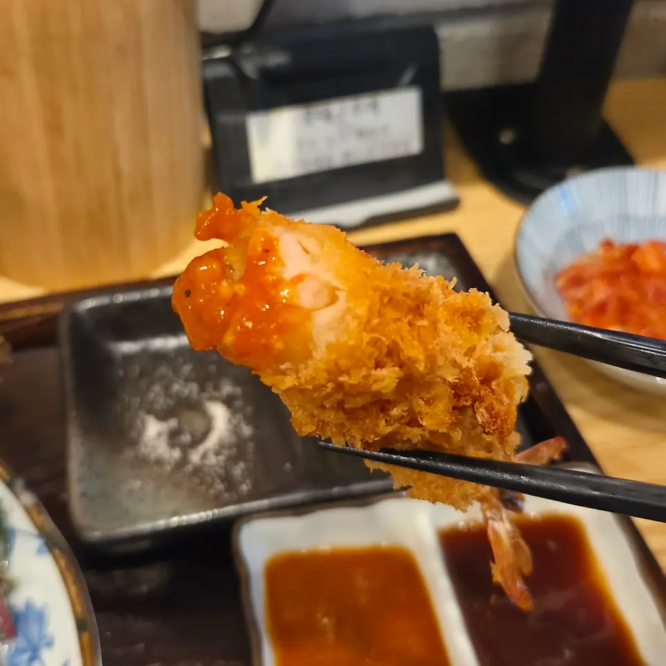 Shrimp katsu dipped in tonkatsu sauce