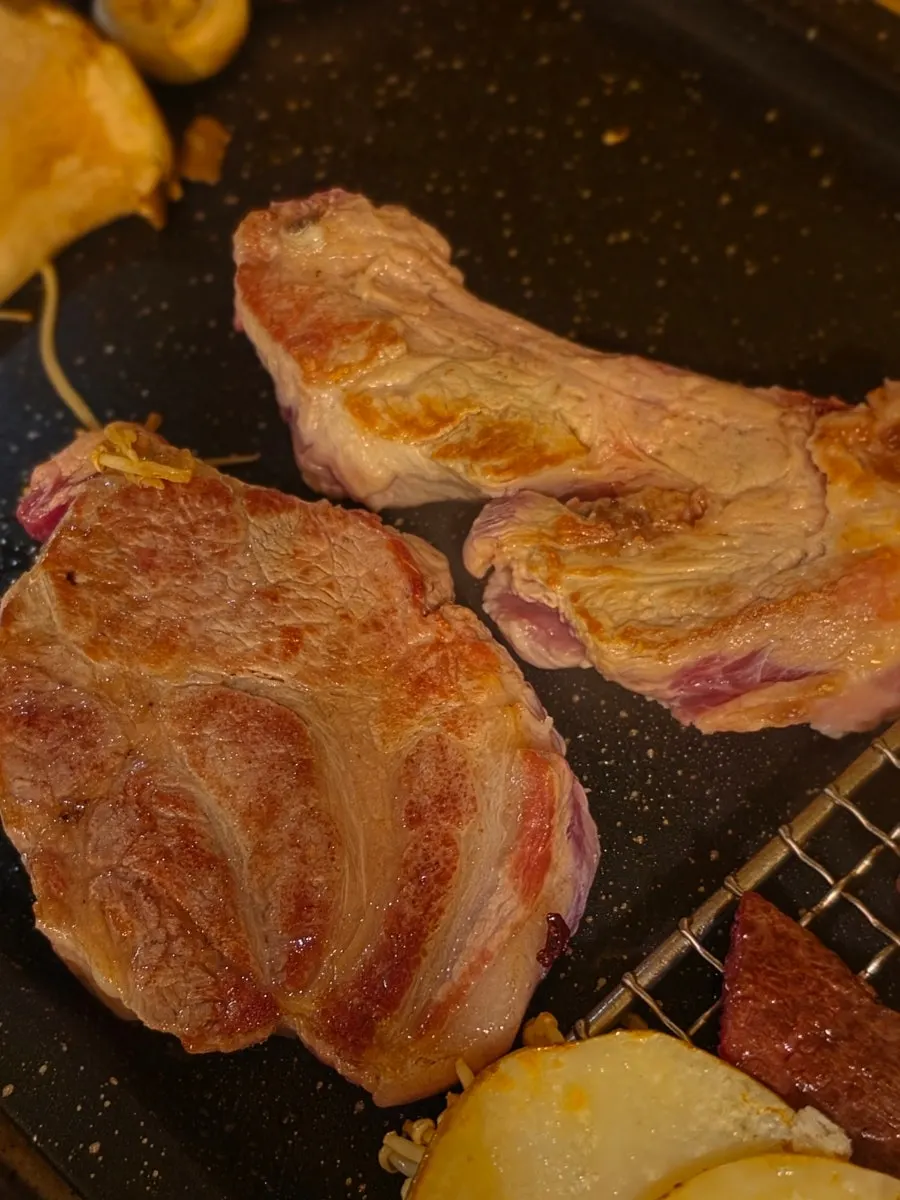 Thick hanwoo pork neck and galbi on the grill
