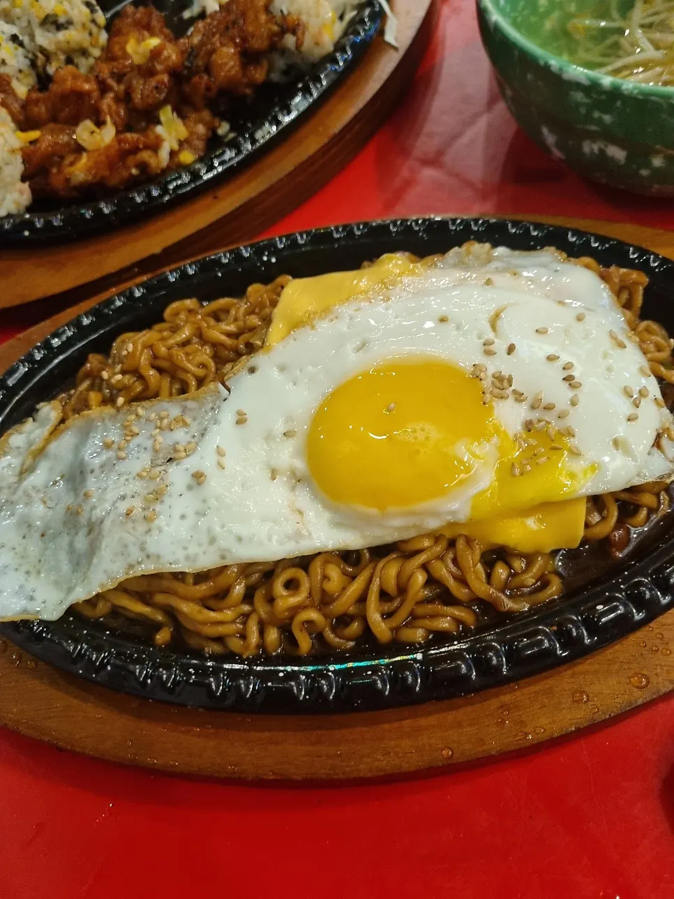 Jjagyechi topped with cheese and egg