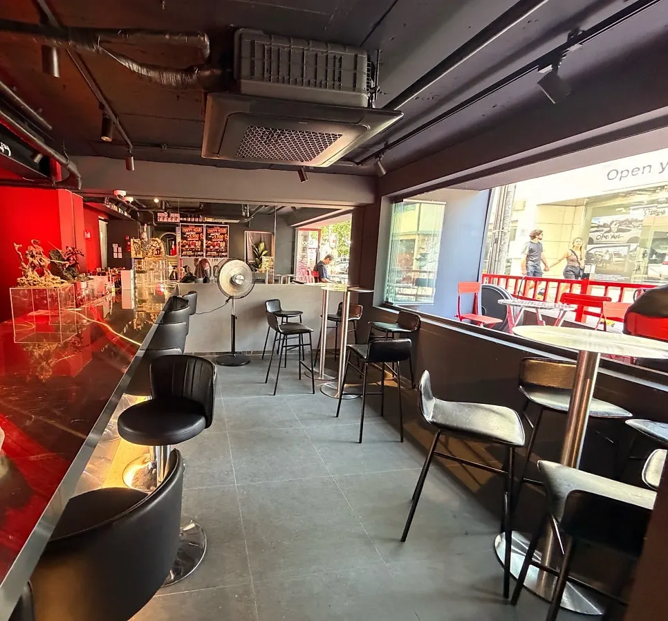 First-floor seating with bar tables and bar chairs