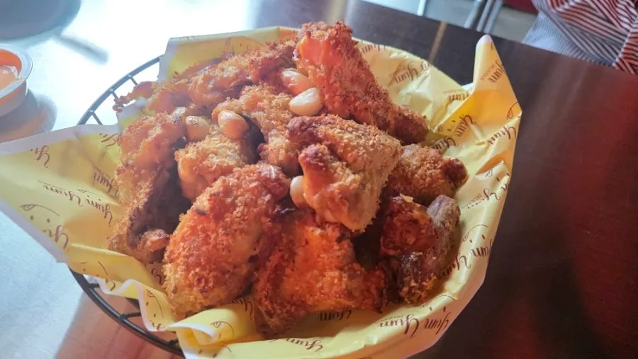 A whole Namhae Garlic Basasak chicken on the table