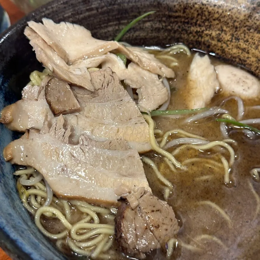 Lifting up a serving of ramen noodles