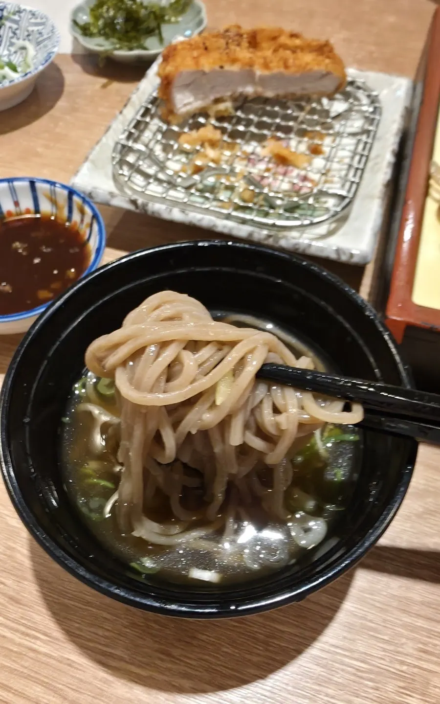 A bite of soba dipped in tsuyu sauce