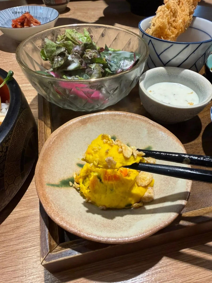 Side plate with sweet pumpkin salad and candied sweet potato