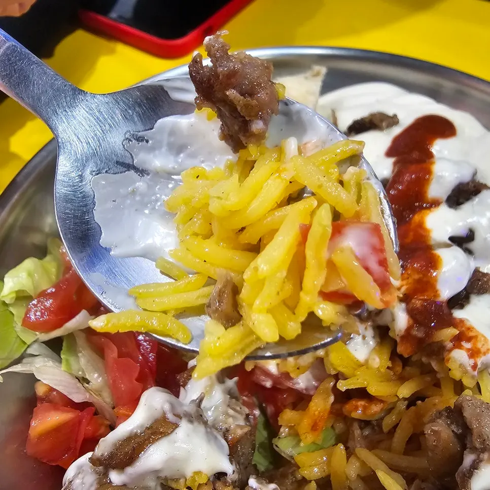 Chicken platter with rice and vegetables mixed together