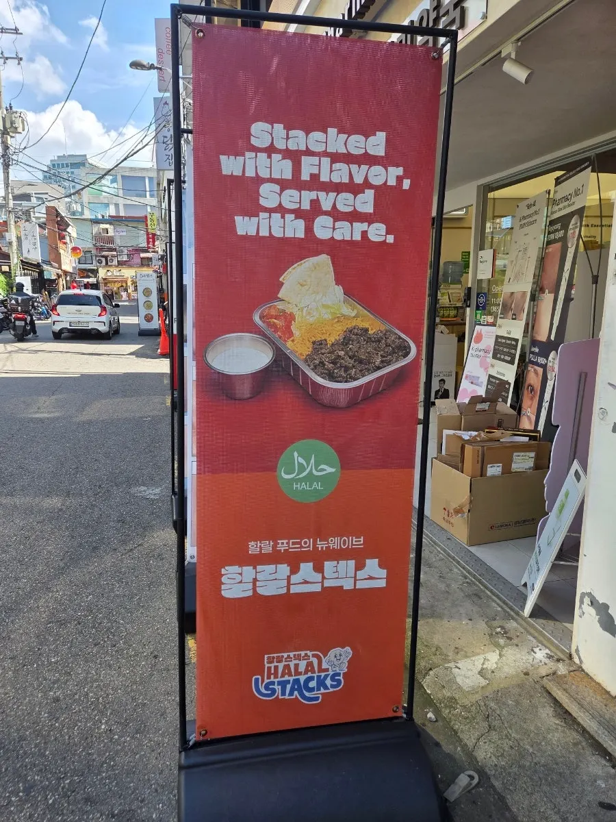 Food photos displayed at the entrance of Halal Steaks