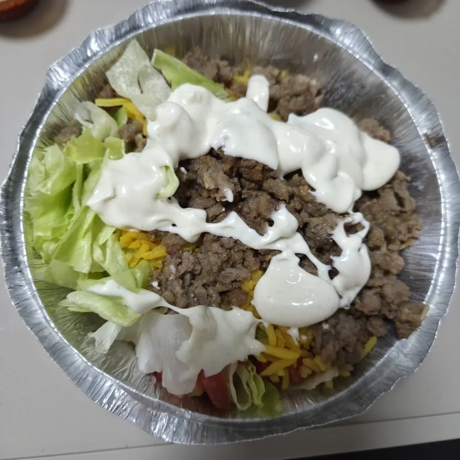 Gyro Platter topped with sauce
