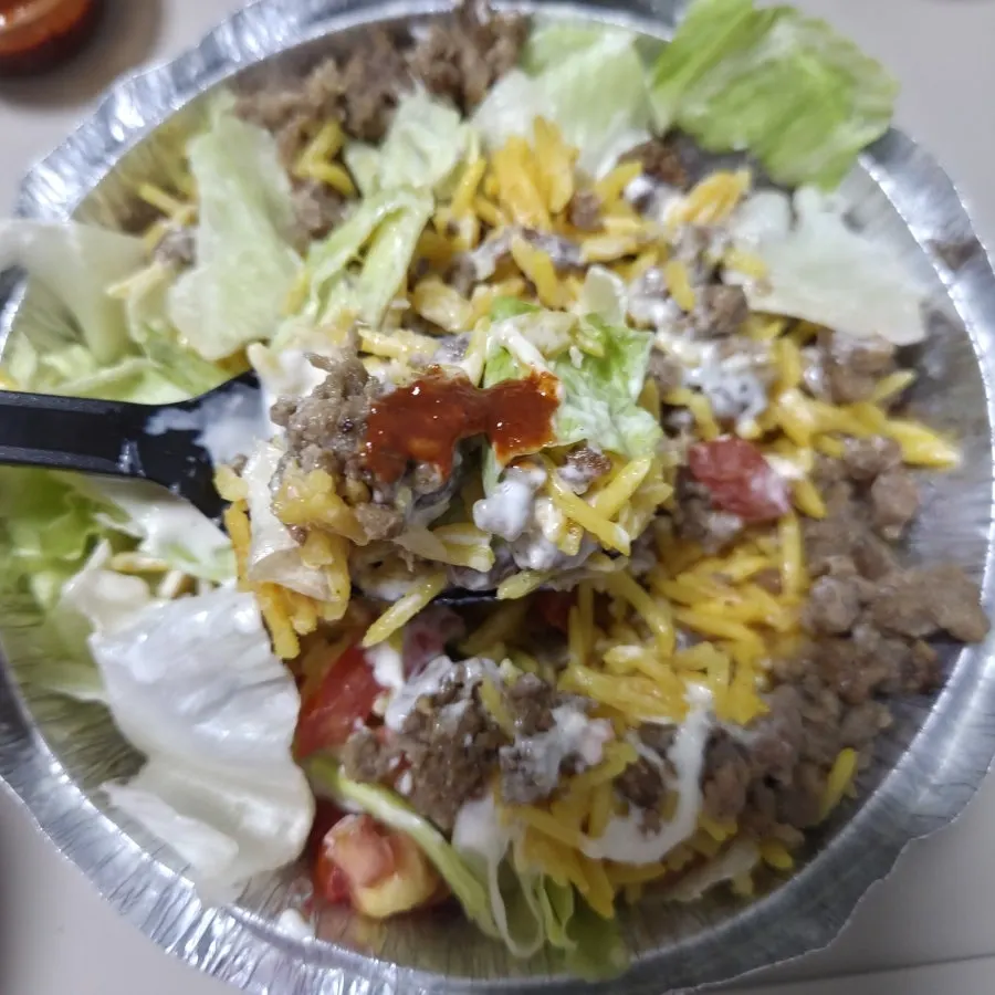 Gyro Platter eaten with hot sauce on top