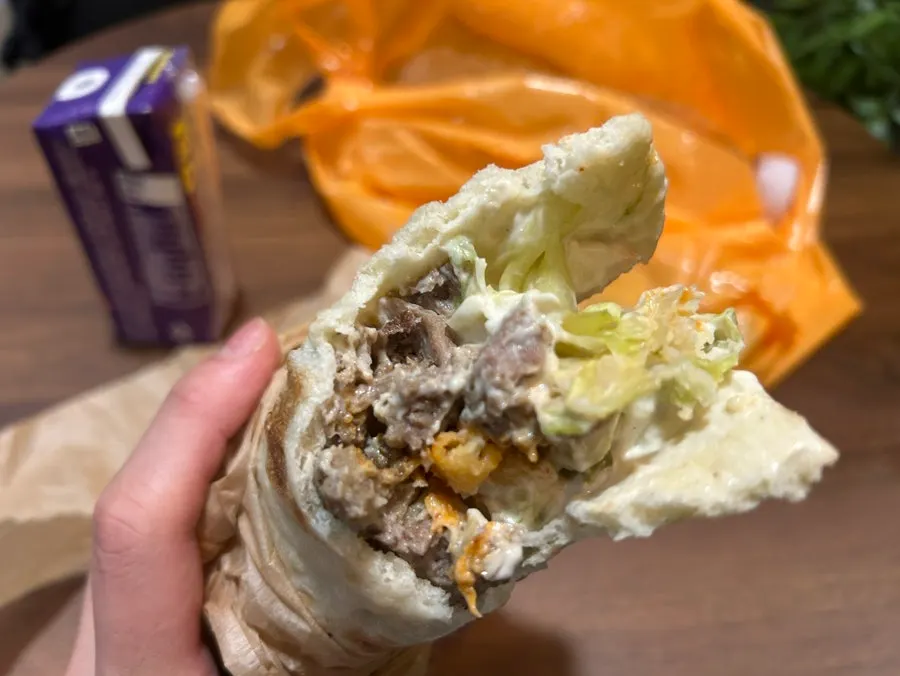 Gyro sandwich loaded with sauce