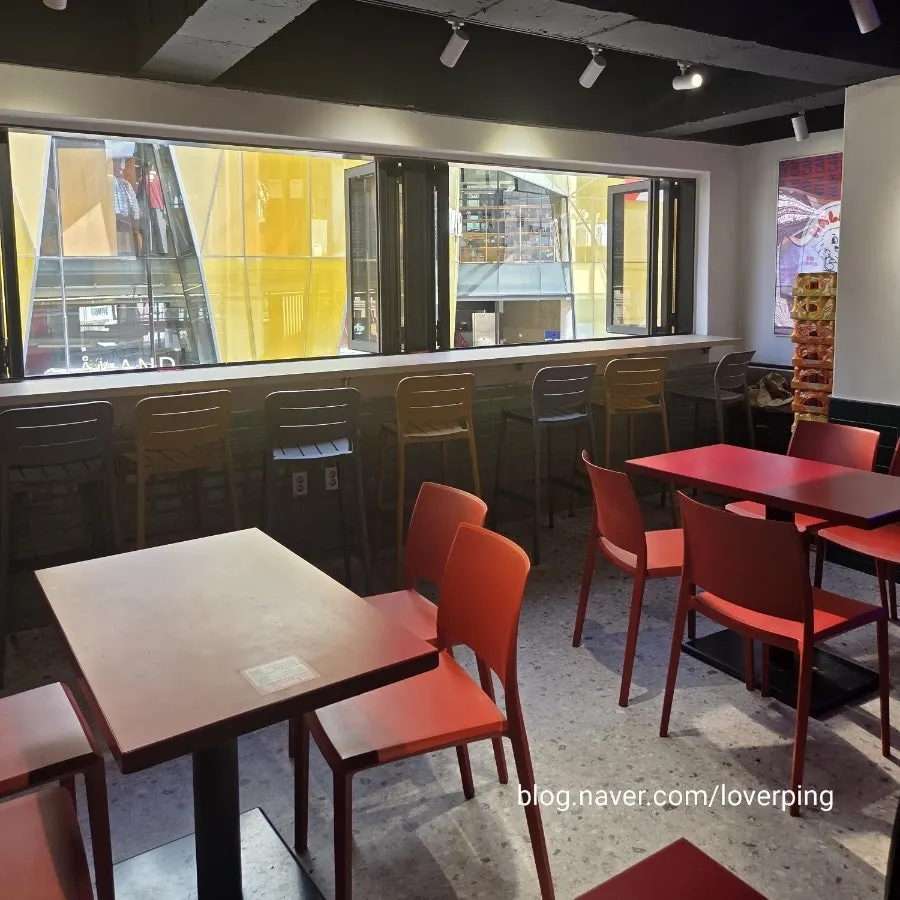 Bar table seating at Halal Steaks with a view outside