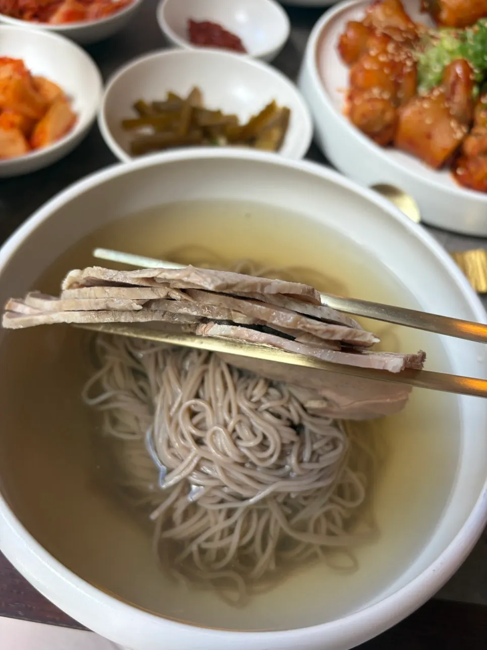 Mul Pyongyang naengmyeon topped generously with pork