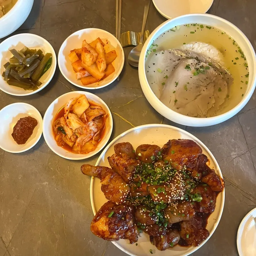 A full spread of gomtang, cold noodles, and braised pork tails