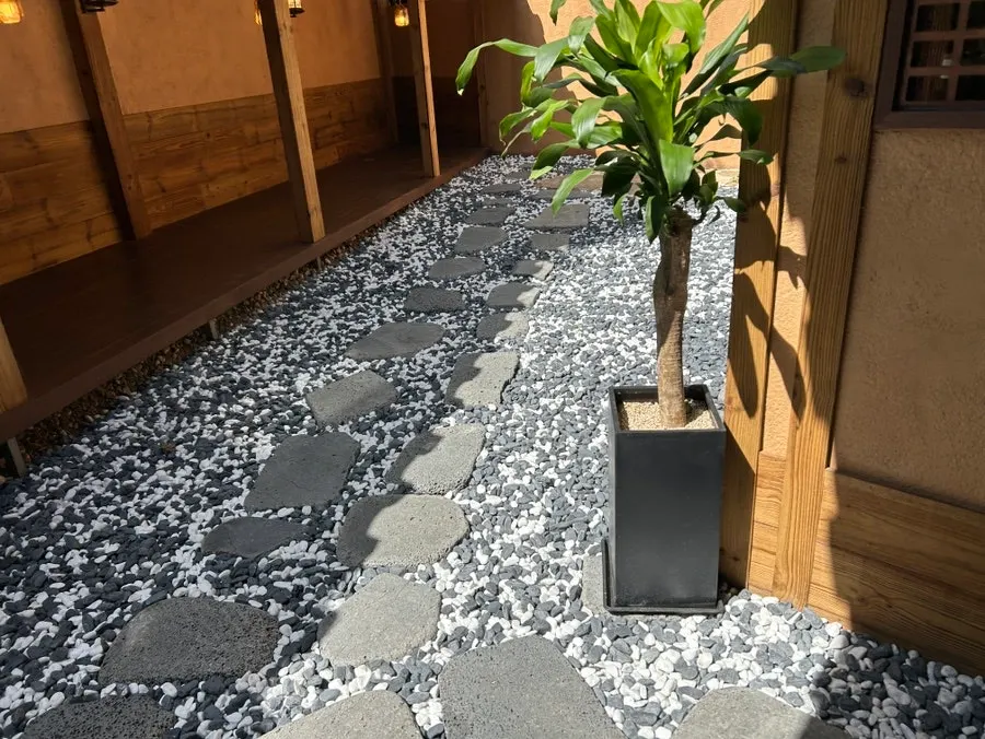 Anok entrance with a gravel path