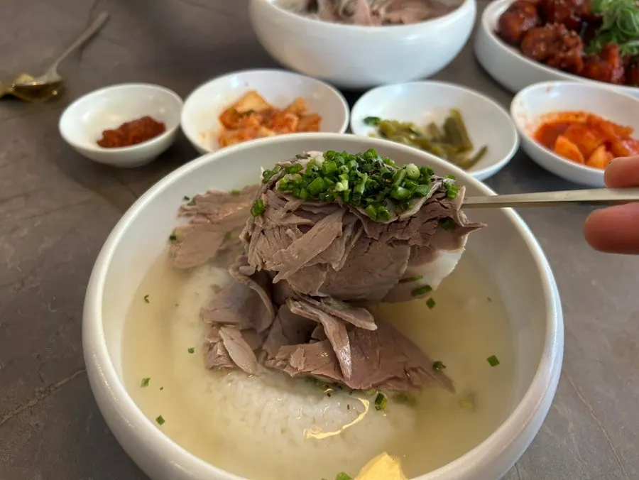 Clear gomtang loaded with meat
