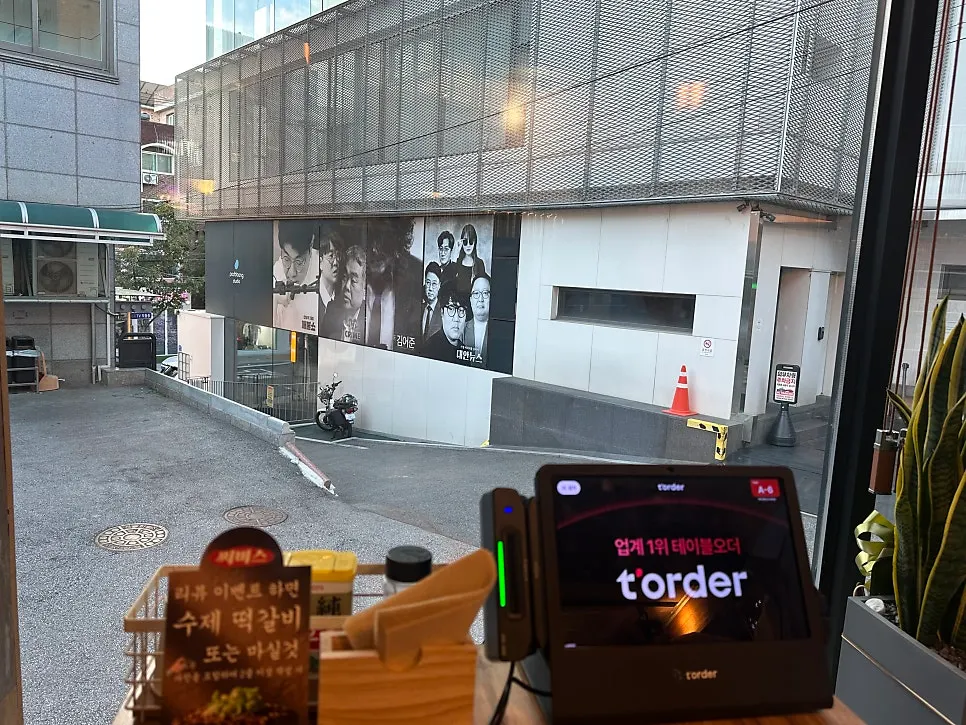 Window seats overlooking a Hongdae side street
