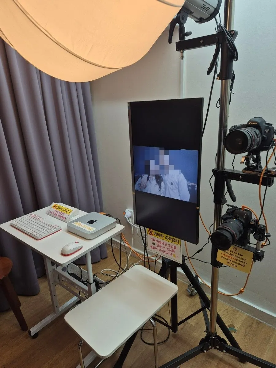 Posing for a self-shoot while watching the monitor